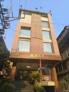 a building with a sign on the front of it at HOTEL 11 JULY in Guwahati