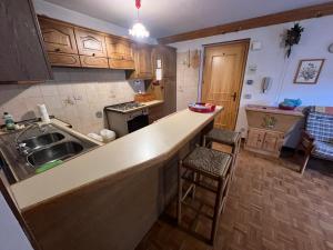 Kuchyň nebo kuchyňský kout v ubytování Casa Ognano (Pellizzano)