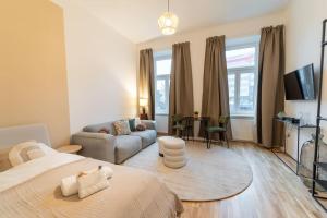 a bedroom with a bed and a living room at Delia Apartment I levestate in Vienna