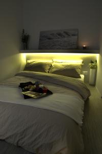 Ένα ή περισσότερα κρεβάτια σε δωμάτιο στο RESIDENCE UNODUETRE