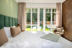 Ein Bett oder Betten in einem Zimmer der Unterkunft Villa Beatrice Inseltraum