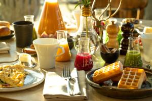 a table with a plate of breakfast food and drinks at Radisson Blu Riverside Hotel in Gothenburg