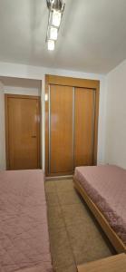 Postel nebo postele na pokoji v ubytování Apartamento 2ª Línea-Oropesa del Mar
