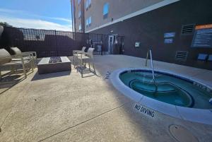 a jacuzzi tub on the side of a building at La Quinta Inn & Suites by Wyndham - Red Oak TX IH-35E in Red Oak