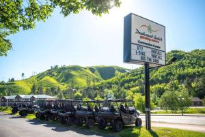 a row of jeep parked next to a sign at Deadwood Gulch Resort, Trademark Collection by Wyndham in Deadwood