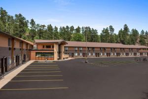 an empty parking lot in front of a building at Deadwood Gulch Resort, Trademark Collection by Wyndham in Deadwood