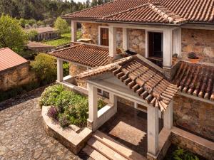 an aerial view of a house with a tile roof at Quinta da Palhota in Vila de Rei