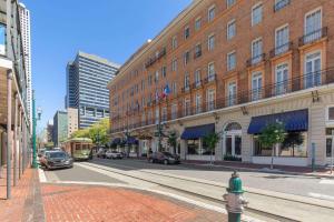 a city street with a building and a fire hydrant at The Lafayette by LuxUrban in New Orleans