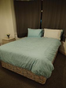A bed or beds in a room at Thales Home GFDBL1