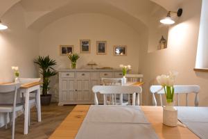 a kitchen and dining room with a table and chairs at Villa Mariolino in San Pellegrino Terme