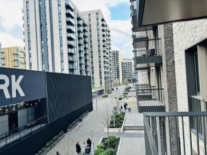 a view of a city street with tall buildings at Your London Escape Luxurious 1 Bedroom Apartment in London
