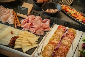 a buffet of different types of food on a table at Hotel MC San José in San José