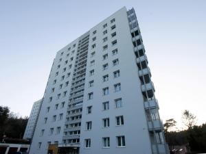 a tall white building with many windows at Mieszkanie Sopot Blue - ACCO RENT in Sopot