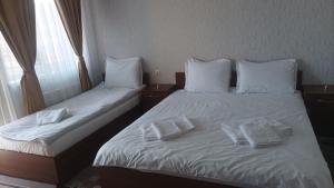 Ein Bett oder Betten in einem Zimmer der Unterkunft Готель Ассоль