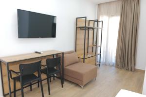 TV a/nebo společenská místnost v ubytování AFA Hotel