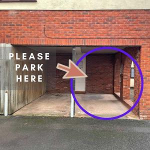 a purple circle with an arrow pointing into a parking garage at 11 Friernhay Court in Exeter