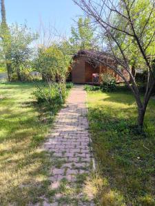 a brick path in front of a house at Fire Pansiyon in Cıralı