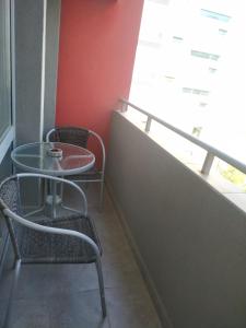 a table and chairs in a room with a window at Gabrovo Relax Apartment in Gabrovo