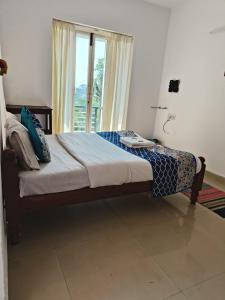 Postel nebo postele na pokoji v ubytování Red Stone Villas