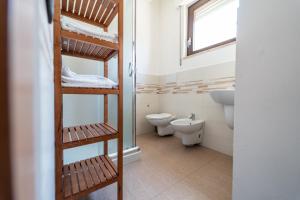 a bathroom with a toilet and a sink at Alta Dimora in Bitritto