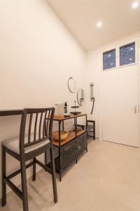 a dining room with a table and a chair at Dorothea Apartment I levestate in Vienna