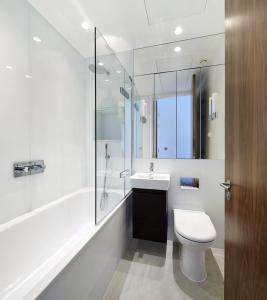 a bathroom with a toilet and a sink and a shower at Luxury Collection - 2 Bedroom Apartment -Borough Market in London