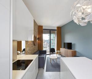 a kitchen and living room with a couch and a table at Luxury Collection - 2 Bedroom Apartment -Borough Market in London