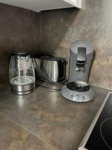 a kitchen counter with a coffee maker and a blender at Ferienwohnung Leonie in Rottweil in Rottweil