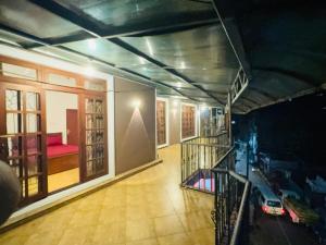a room with a balcony with a car on it at SkyLark Guest House in Nawalapitiya