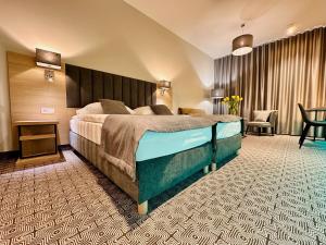 Posteľ alebo postele v izbe v ubytovaní Hotel Turkus