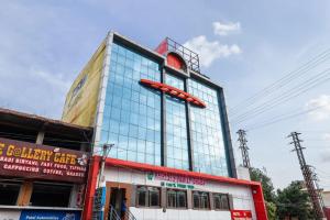 a building with a sign on the side of it at HOTEL SANTHOSH DHABA SUITES-NEAR AIRPORT Zone in Shamshabad