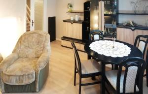 a dining room with a table and chairs at Cozy Apartment In Ahlbeck Bei Ueckermnd With Wifi in Ahlbeck