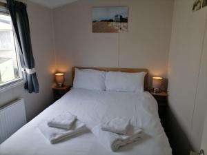 Cama o camas de una habitación en The Beach - Large decking area