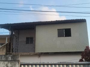 a building with two windows on top of it at Minha casa fora de casa in João Pessoa