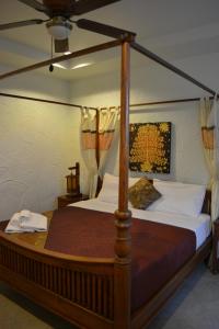 Кровать или кровати в номере Nirvana Guesthouse & Hostel