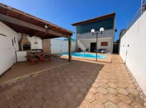 an image of a house with a swimming pool at Linda casa com piscina in São Miguel do Gostoso