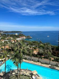 an aerial view of a resort with a swimming pool at Luxurious Monaco Flat: Stunning Views & Amenities in Monte Carlo