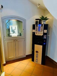 a room with a pizza box next to a door at Hotel Baslertor in Lucerne