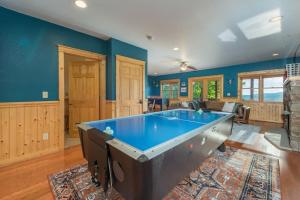 a large living room with a pool table at The Skybox Cabin Stunning Views HotTub Game Room in Swiss