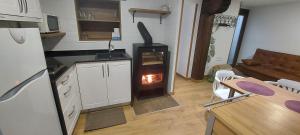 a kitchen with a stove in the middle of a room at Subida san juan in San Vicente de la Sonsierra
