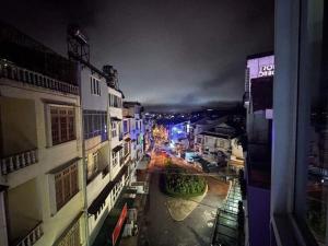 a view of a city street at night at ROSE HOSTEL DALAT in Da Lat