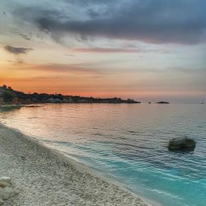 a view of the beach at sunset at 4 Seasons villa-Sea view in Hersonissos