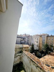 a view of a city from a window of a building at suite orientale du vieux port in Marseille