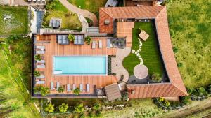 an overhead view of a house with a swimming pool at Hotel Kassian in Lagundo