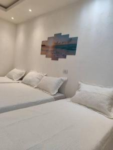 A bed or beds in a room at Apartamento inteligente