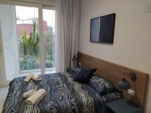 Posteľ alebo postele v izbe v ubytovaní Taormina Lukos House in center with pool by Taormina Holidays