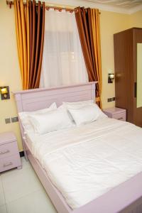 Postel nebo postele na pokoji v ubytování Blanket Suites