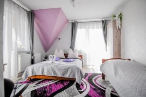 Postel nebo postele na pokoji v ubytování Kukucówka Zakopane