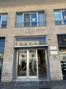 a building with a glass door in front of it at Margherita's House in Bari