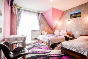 Postel nebo postele na pokoji v ubytování Kukucówka Zakopane